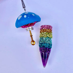 Glass Mushroom Pendant Stash Necklace open with a medium sized spoon inside the lid