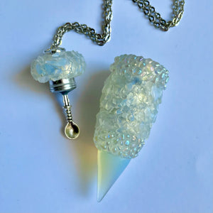 Secret Stash Jewelry pendant necklace with iridescent Opalite cyrstals and clear aura pearl bands and an Opal tip open with a medium sized spoon scoop inside the lid.
