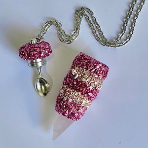 Vial Pendant Necklace with two-toned pink striped crystal details with a Rose Quartz point and a large sized spoon scoop inside the lid.