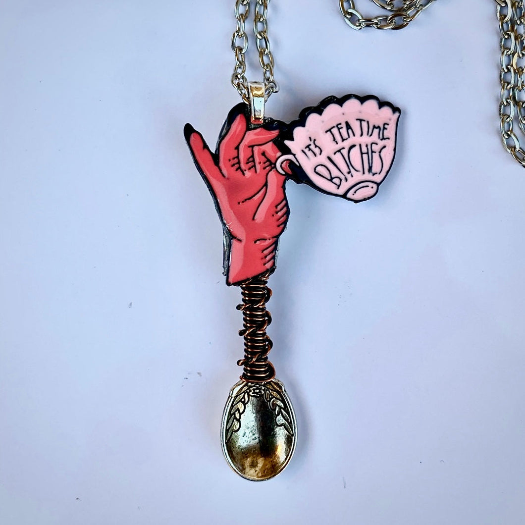 What's the Tea Tiny Festival Spoon Necklace with a 'Tea Time' charm centerpiece and matching wire wrapping on a large size silver spoon base.