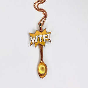 Custom Festival Gold Spoon Necklace featuring a "WTF?!" centerpiece charm on a large scoop size gold spoon pendant base.