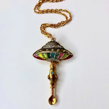 Custom Spaceship Tiny Festival Spoon Necklace featuring an out of this world UFO centerpiece charm with a complimenting rocket charm on a medium scoop size gold spoon pendant and matching gold chain.