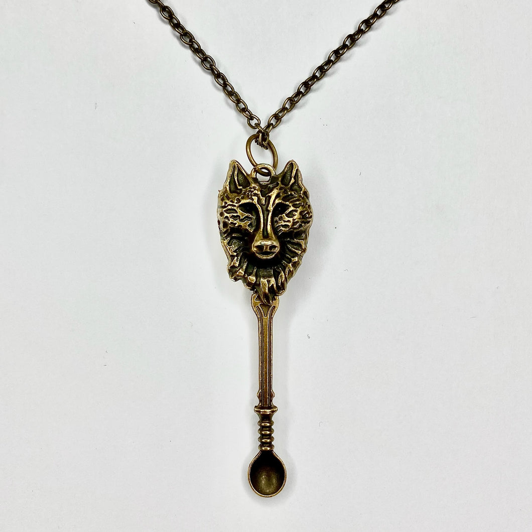 Custom Tiny Festival Spoon Necklace featuring a rustic bronze wolf spoon pendant with matching bronze chain.